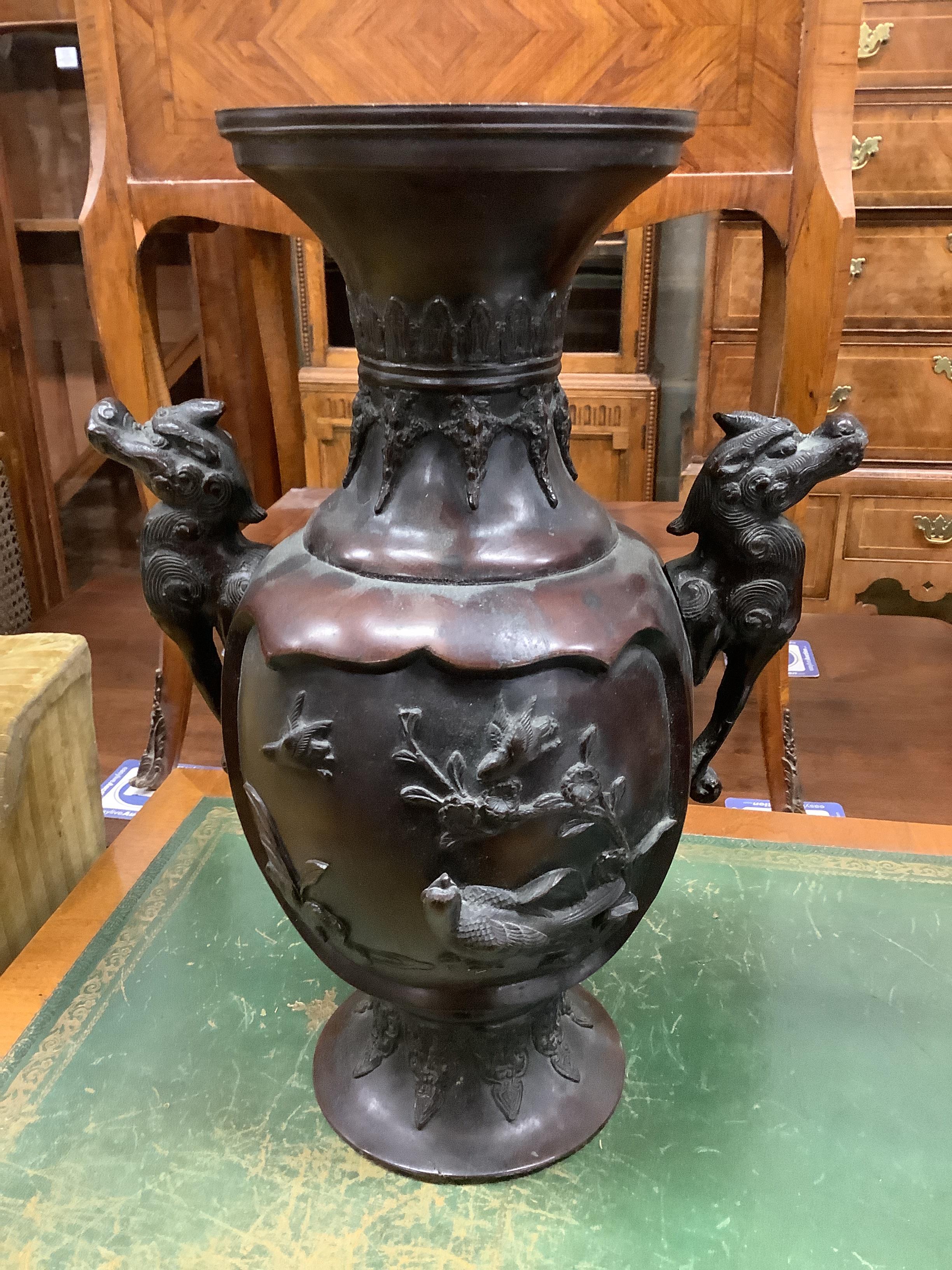 A Chinese circular marble topped vase stand, height 56cm together with a Japanese bronze two handled vase